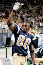 St. Louis Rams wide receiver Isaac Bruce holds one of his jerseys after  offically retiring from the National Football League at the team  headquarters in Earth City, Missouri on June 9, 2010.