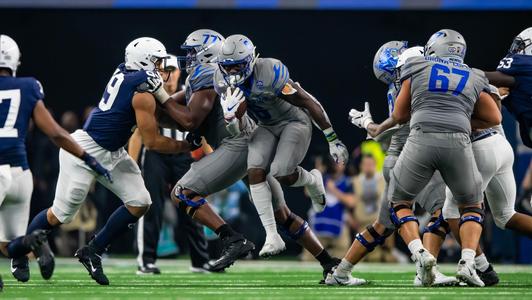 Troy running back D.J. Taylor (31) is stopped by South Alabama