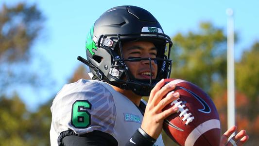 Mason Fine on sidelines with teammates] - UNT Digital Library