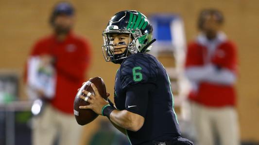 Mason Fine on sidelines with teammates] - UNT Digital Library