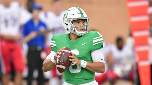 Mason Fine on sidelines with teammates] - UNT Digital Library