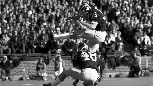 Photographer Tackles Fan Who Ran on Field During College Football Game