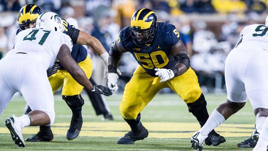 Michael Onwenu sticks with Michigan