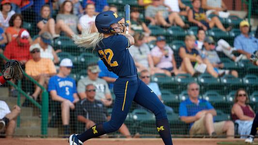 Denny Wagner supports his daughter Haley in softball