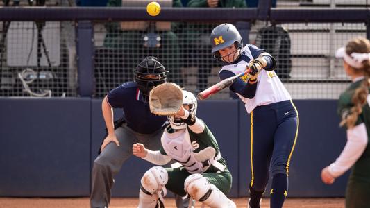 Denny Wagner supports his daughter Haley in softball