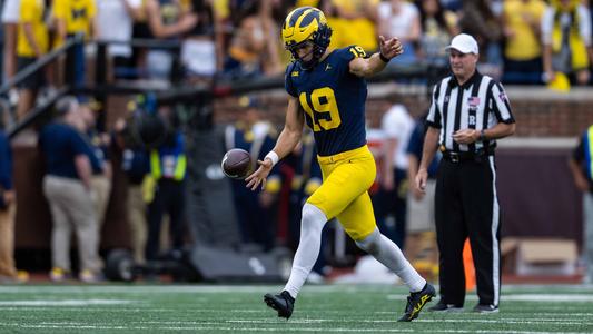 game used/authentic University of Michigan football jersey