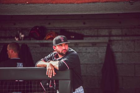 Miami Marlins first base coach Keith Johnson checks out a cricket