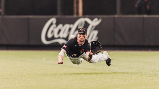 Baseball Player Diving to Catch Ball in Stadium Photo
