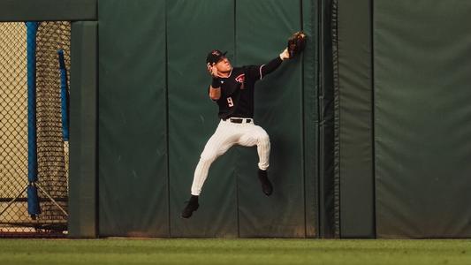 Download A Baseball Player In Red Gear Is Ready To Catch A Ball