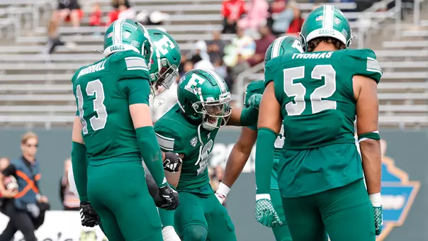 Bryce Llewellyn celebrates after intercepting an NIU pass