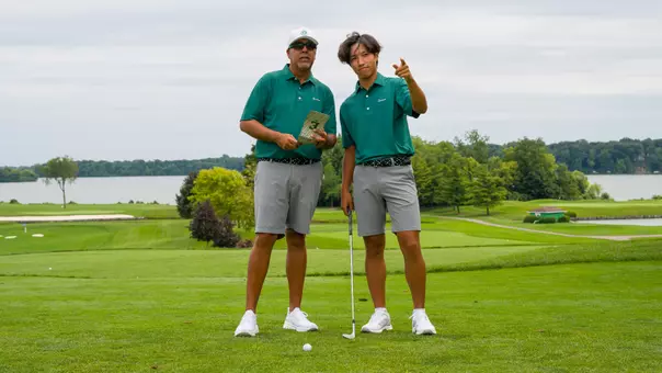 Tim Chan and Andy Walker survey the course ahead of a shot