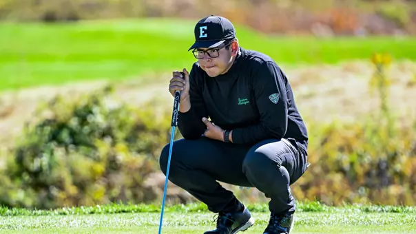 Vicente Quiroga squats down to study the green before attempting at putt at the Nemacolin Collegiate Invitational.