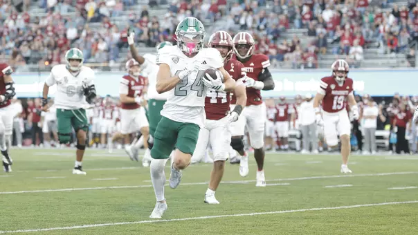 Joey Mattord breaks through the line one his way to a 25-yard touchdown run at UMass, Oct. 3.