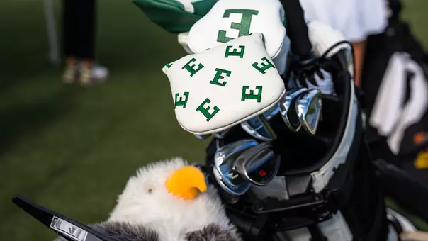 Clubhead covers with the E logo on clubs in the bag at the driving range ahead of a tournament