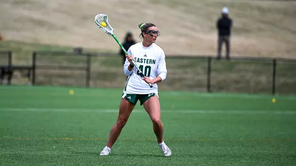 Emma Reichert holds the ball as she surveys the offensive zone in a home game against Kent State