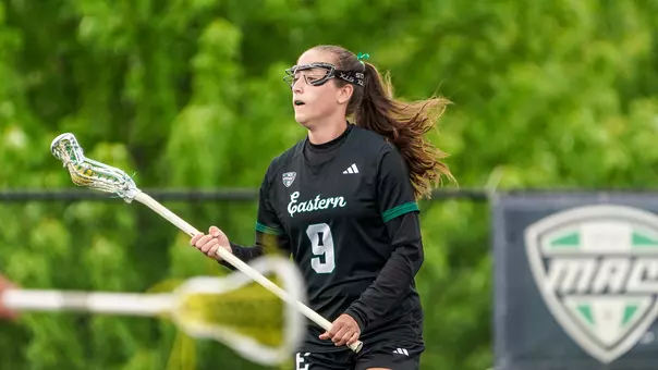 Kelsea Dague cradles the ball and surveys the defense as she prepares her next move toward the goal