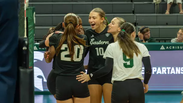 Haley Trosky and the 2026 EMU volleyball team celebrate a point in an exhibition at Michigan State, Aug. 19, 2026