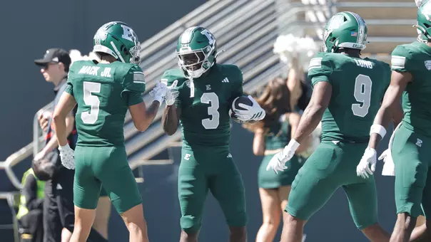 Benson Prosper (3) celebrates his firs career touchdown catch in the end zone with Harold Mack, Jr. (5), in the game against Lindenwood