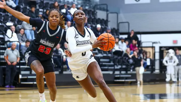 Sabou Gueye driving to the basket during a non conference match against Howard University