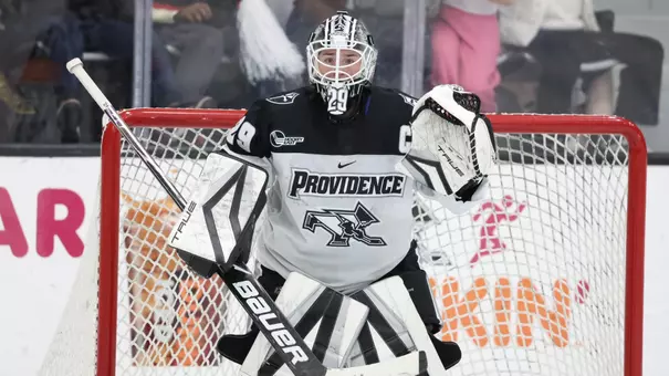 Women's ice hockey goalie Hope Walinski preparing to make a save during a game