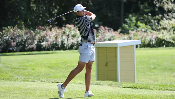 Men's golf player Campbell Skelly holding his follow through after a tee shot