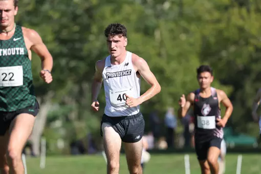 Cormac Dixon running for the Friars during a 2025 cross country meet.