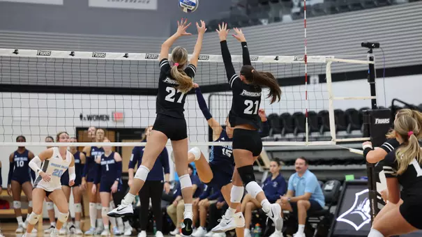 Kaia Easterbrook and Sophia Adkins Blocking at Alumni Hall in Providence, R.I. on Friday, Sept. 5 in their 3-0 win over Rhode Island