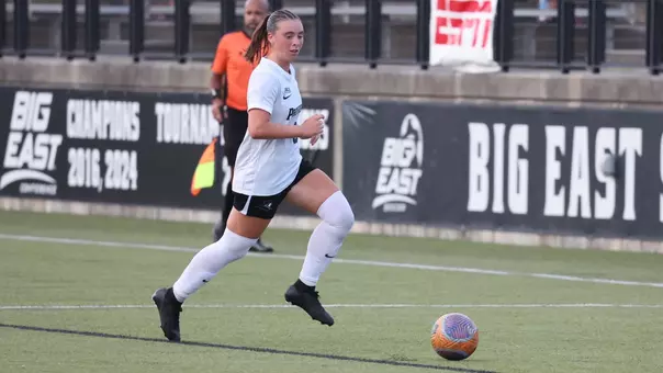 Women's Soccer player Colleen Casey runs with the ball at Chapey Field at Anderson Stadium versus Army