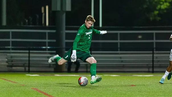 Ryan Carney kicks the ball vs Brown