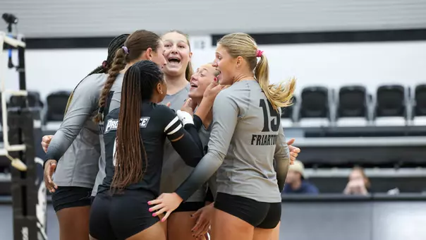2025 Volleyball Team Celebrating in their match against Brown at Alumni Hall