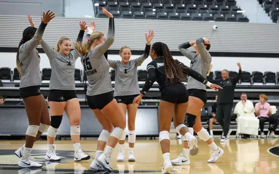 The Volleyball Team Celebrating in the 2025 season at their match against Brown in Alumni Hall