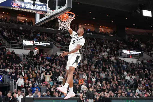 Jamier Jones dunks the ball on the fast break versus Creighton at the Amica Mutual Pavilion.