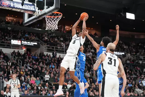 Jamier Jones finishes a layup through contact versus Creighton at the Amica Mutual Pavilion.