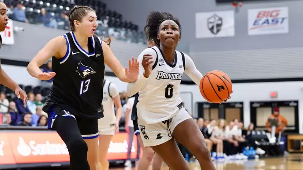 Sabou Gueye driving to the basket at Alumni Hall during a Big East game against Creighton