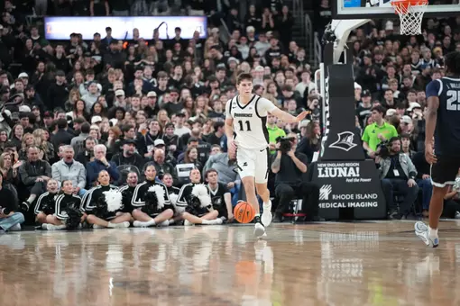 Ryan Mela dribbles the ball up the floor versus Georgetown at the Amica Mutual Pavilion.