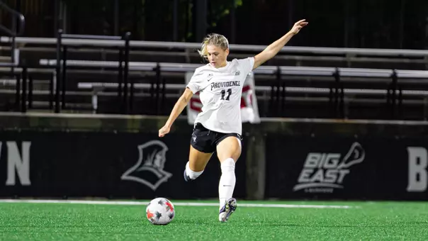 Carolyn Hinkle kicking soccer ball