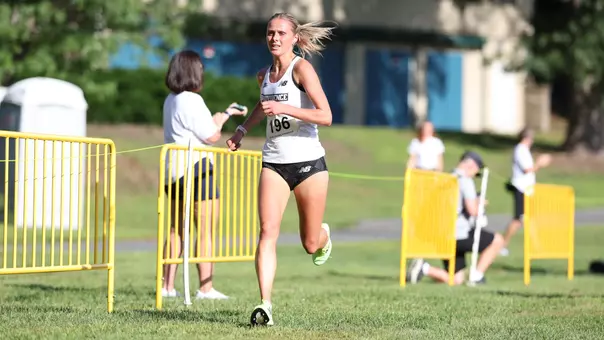 Women's cross country runner Anna Gardiner running at the Friar Invitational