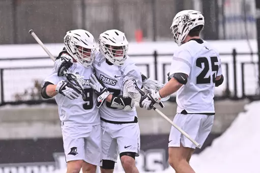 Men's Lacrosse celebrates goal versus Bryant on Chapey Field at Anderson Stadium.