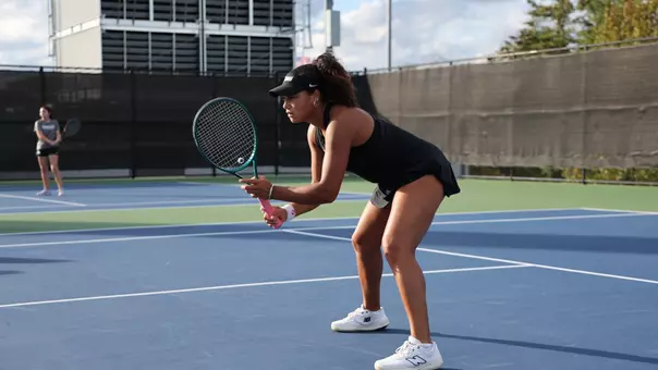 Women's Tennis' Audrey Magnusen in action against Assumption
