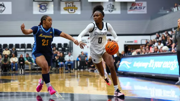 Sabou Gueye dribbling past a Marquette defender during a BIG EAST game at Alumni Hall in Providence, R.I.