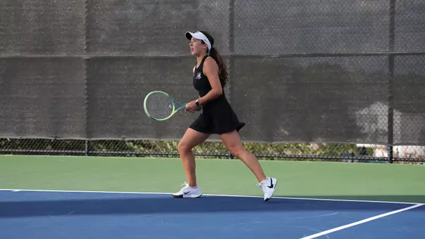 Women's Tennis' Lauren Krise in action against Assumption