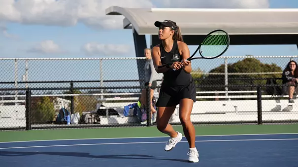 Women's Tennis' Gabriella Plonowski in action against Assumption University