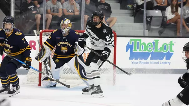 Men's hockey's John Mustard in action against Quinnipiac