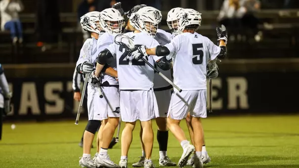 Providence men's lacrosse attack unit celebrates a goal in the BIG EAST Semifinals at Chapey Field at Anderson Stadium.