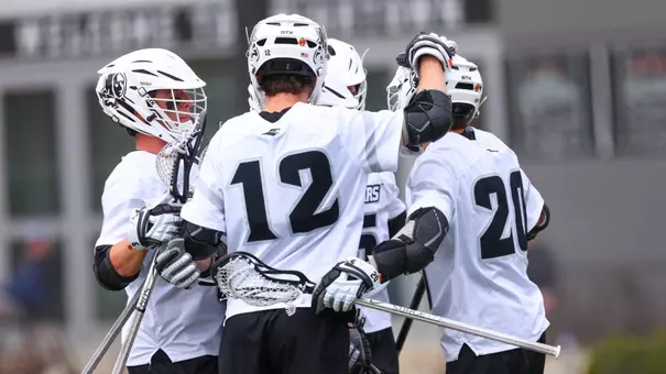 Mens Lacrosse team action photo on chapey field at anderson stadium