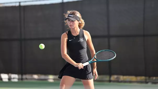 Women's Tennis' Sophie Ahlberg in action against Assumption