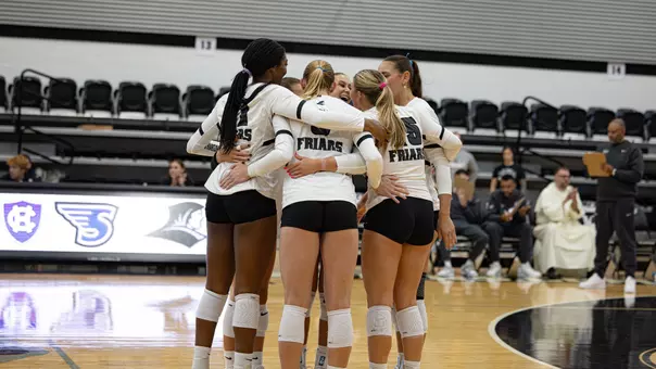 Providence Volleyball Huddle after a point against Manhattan
