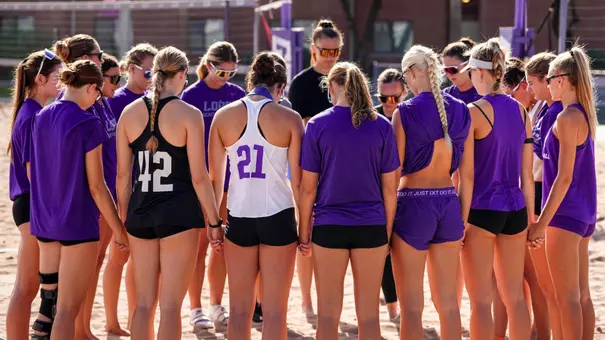 Beach volleyball practice huddle