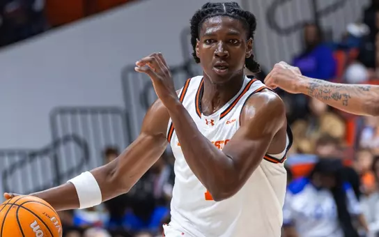 CJ Beaumont dribbles against FIU at Johnson Coliseum