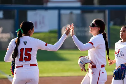 Lauryn Carranco and Natalie Elias high five